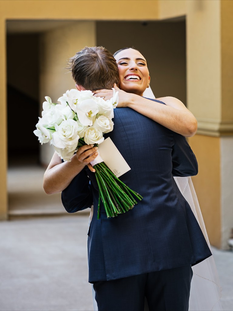 Bride hugging her father at a Cabo wedding