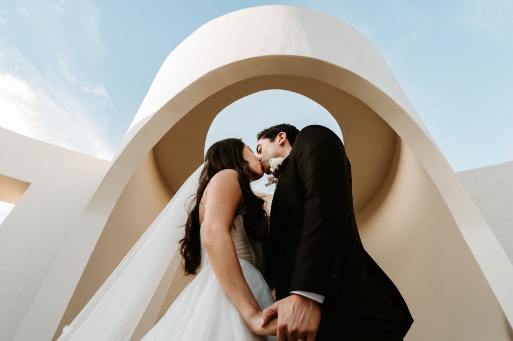 Ceremony kiss at a Los Cabos destination wedding